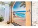 Unique bathroom featuring a poolside mural, a bright window, and contemporary fixtures at 4740 Carrington Cir, Sarasota, FL 34243