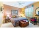 Inviting bedroom with a comfortable bed, wood accents, and a window for natural light and seating at 4740 Carrington Cir, Sarasota, FL 34243