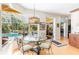 Bright dining area with a glass table and views of the pool at 4740 Carrington Cir, Sarasota, FL 34243
