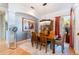 Dining room features elegant chandelier, wood table set and stylish decor at 4740 Carrington Cir, Sarasota, FL 34243