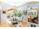 Charming dining area with views of the pool and outdoor space at 4740 Carrington Cir, Sarasota, FL 34243