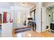 Inviting foyer with hardwood floors, glass double doors and elegant furnishings at 4740 Carrington Cir, Sarasota, FL 34243