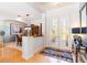 Inviting foyer with hardwood floors and elegant glass double doors at 4740 Carrington Cir, Sarasota, FL 34243