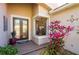 Elegant front entrance with double doors, brick walkway, and lush landscaping providing great curb appeal at 4740 Carrington Cir, Sarasota, FL 34243