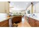 Modern kitchen with updated appliances, custom cabinets, and granite countertops at 4740 Carrington Cir, Sarasota, FL 34243