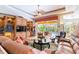 Inviting living room with access to the lanai and pool area at 4740 Carrington Cir, Sarasota, FL 34243