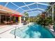 Gorgeous pool with inviting blue water, seating areas, and tropical plants, creating an idyllic backyard for leisure at 4740 Carrington Cir, Sarasota, FL 34243