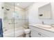 Bright bathroom with a glass-enclosed shower, tiled walls, and a white vanity at 4852 Peregrine Point N Cir, Sarasota, FL 34231