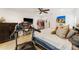 Comfortable bedroom featuring a treadmill and ceiling fan offers a relaxing atmosphere with modern amenities at 4852 Peregrine Point N Cir, Sarasota, FL 34231