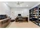 Spacious home office with custom desk and ample shelving and natural light at 4852 Peregrine Point N Cir, Sarasota, FL 34231