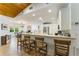 Modern kitchen with a breakfast bar, white cabinetry, and stainless steel appliances at 4852 Peregrine Point N Cir, Sarasota, FL 34231
