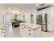 Well-lit kitchen featuring stainless steel appliances and a central island with seating at 4852 Peregrine Point N Cir, Sarasota, FL 34231