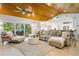 Inviting living room with a plush sectional sofa and natural light at 4852 Peregrine Point N Cir, Sarasota, FL 34231