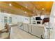 Open-concept living space showcasing wood ceilings, a fireplace, and seamless flow at 4852 Peregrine Point N Cir, Sarasota, FL 34231