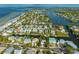 Stunning aerial view of waterfront homes, showcasing a desirable coastal community and convenient canal access at 516 Kumquat Dr, Anna Maria, FL 34216