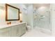 Updated bathroom featuring a glass enclosed shower and modern vanity at 516 Kumquat Dr, Anna Maria, FL 34216