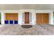 Inviting home entrance featuring a solid wood door, brick pavers, and impact rated garage doors at 516 Kumquat Dr, Anna Maria, FL 34216