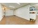 Spacious garage with overhead lighting and an epoxy floor at 516 Kumquat Dr, Anna Maria, FL 34216
