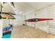Spacious garage with brick floor, white walls, and ample kayak and storage space at 516 Kumquat Dr, Anna Maria, FL 34216