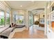 Hallway with window seat, view to the bedroom, and built-in bookshelf at 516 Kumquat Dr, Anna Maria, FL 34216