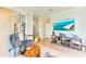 Comfortable living room features a large flatscreen TV and decoratively stocked shelving at 516 Kumquat Dr, Anna Maria, FL 34216
