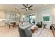 Bright living room with large windows, an open layout, and stylish furniture at 516 Kumquat Dr, Anna Maria, FL 34216