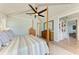 Large main bedroom features a ceiling fan, walk-in closet, and hard wood floors at 516 Kumquat Dr, Anna Maria, FL 34216