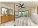 Main bedroom with hardwood floors, a ceiling fan, and balcony access at 516 Kumquat Dr, Anna Maria, FL 34216
