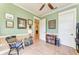 Calm office featuring light walls, wood floors, and ample built in storage at 516 Kumquat Dr, Anna Maria, FL 34216