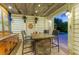 Stylish outdoor bar with a unique barrel table and backyard pool at 516 Kumquat Dr, Anna Maria, FL 34216