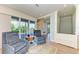 Cozy sitting area features comfortable chairs and sliding doors to balcony at 516 Kumquat Dr, Anna Maria, FL 34216