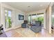 Cozy sitting room with comfortable chairs and outdoor views at 516 Kumquat Dr, Anna Maria, FL 34216