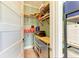 Well-organized storage room with wooden shelving, painted walls, and plenty of space at 516 Kumquat Dr, Anna Maria, FL 34216