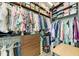 Organized walk-in closet with wooden shelves and drawers provides ample storage for clothing and accessories at 516 Kumquat Dr, Anna Maria, FL 34216