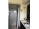 Bathroom featuring a tiled walk-in shower, modern fixtures, and ample vanity space at 5180 Guava Ter, Port Charlotte, FL 33981