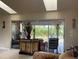 Bright living room with skylights and a sliding glass door at 5180 Guava Ter, Port Charlotte, FL 33981