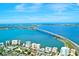 Enjoy the waterfront view with beach access and a bridge to the islands along the horizon at 5557 Long Shore Loop, Sarasota, FL 34238