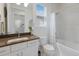 Well-lit bathroom with a vanity, toilet, combination shower and tub, and neutral tones creating a soothing atmosphere at 5557 Long Shore Loop, Sarasota, FL 34238