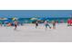 Siesta Key beach with white sand, blue water, and people enjoying a sunny day on the water at 5557 Long Shore Loop, Sarasota, FL 34238