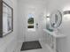 Bright foyer with elegant decor, white walls, and a view of the front door at 5557 Long Shore Loop, Sarasota, FL 34238