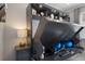 Convenient home office area with a built-in desk and shelving unit that converts to a bed for flexible space at 5557 Long Shore Loop, Sarasota, FL 34238