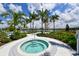 Take a dip in the community hot tub, surrounded by lush landscaping and serene views at 5557 Long Shore Loop, Sarasota, FL 34238