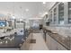 Open concept kitchen with gray cabinets, a large island, stainless steel appliances, and marble flooring at 5557 Long Shore Loop, Sarasota, FL 34238