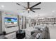 Open concept living room featuring modern decor, a large sectional, and a seamless flow into the kitchen at 5557 Long Shore Loop, Sarasota, FL 34238