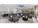 Spacious living room with comfortable seating, stylish decor, and a seamless flow to outdoor space at 5557 Long Shore Loop, Sarasota, FL 34238