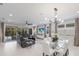 Open living space with modern furnishings, a large sectional, and access to the lanai at 5557 Long Shore Loop, Sarasota, FL 34238