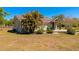 Lush backyard featuring mature trees and an outdoor seating area at 5860 Brown Ln, Sarasota, FL 34232