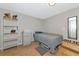 Cozy bedroom with wood floors, neutral walls, and modern furniture, offering a comfortable and stylish living space at 5860 Brown Ln, Sarasota, FL 34232