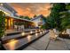 Multi-level backyard deck with outdoor seating and a cozy fire pit, perfect for outdoor gatherings at 587 47Th St, Sarasota, FL 34234
