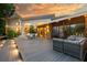 Beautiful backyard features a spacious deck with outdoor seating and string lights, perfect for entertaining at 587 47Th St, Sarasota, FL 34234